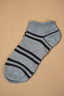 Gray ankle sock with black stripes on a beige background.